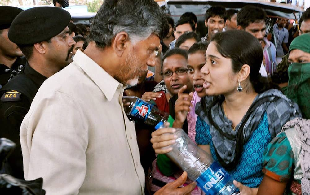 Andhra Pradesh Chief Minister N Chandrababu Naidu interacting with cyclone-hit people in Visakhapatnam.