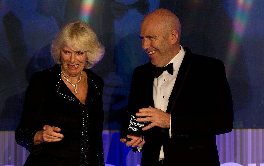 Winner of the Man Booker for fiction 2014 Australian author Richard Flanagan, author of 'The Narrow Road to the Deep North', is congratulated by Camilla, Duchess of Cornwall as he is presented with the prize at the Guildhall in London.