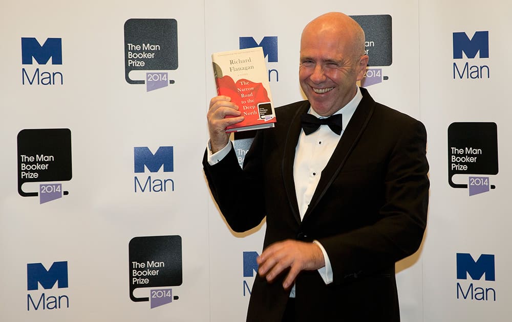 Winner of the Man Booker for fiction 2014 Australian author Richard Flanagan, author of 'The Narrow Road to the Deep North', poses for the camera after winning the prize at the Guildhall in London.