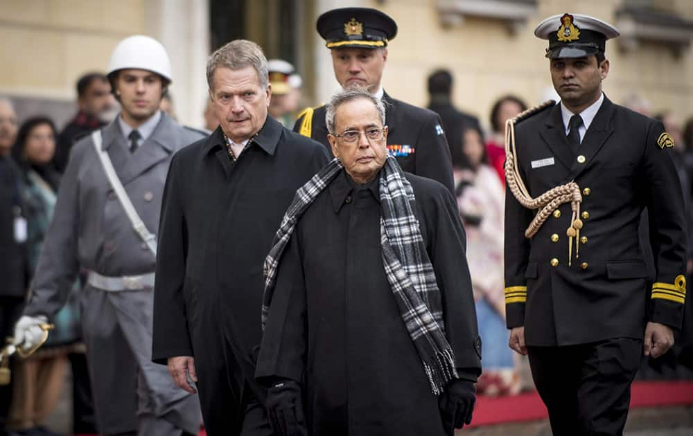 President Pranab Mukherjee and his Finnish counterpart Sauli Niinisto, review a guard of honor during an official welcoming ceremony at the Government Banquet Hall in Helsinki, Finland.