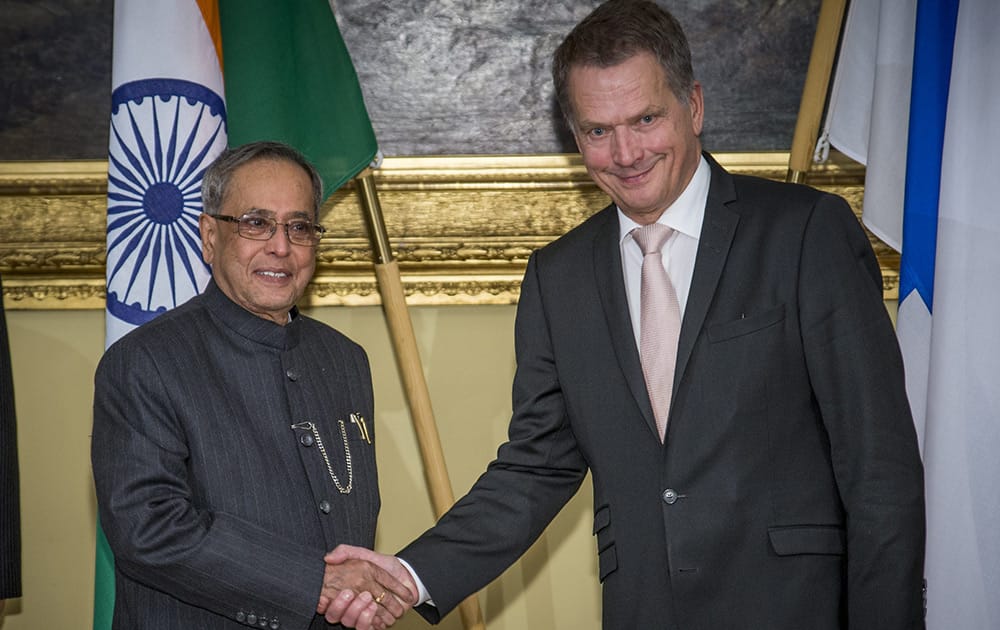 President Pranab Mukherjee, shakes hands with his Finnish counterpart Sauli Niinisto during their joint press conference at the Government Banquet Hall in Helsinki, Finland.