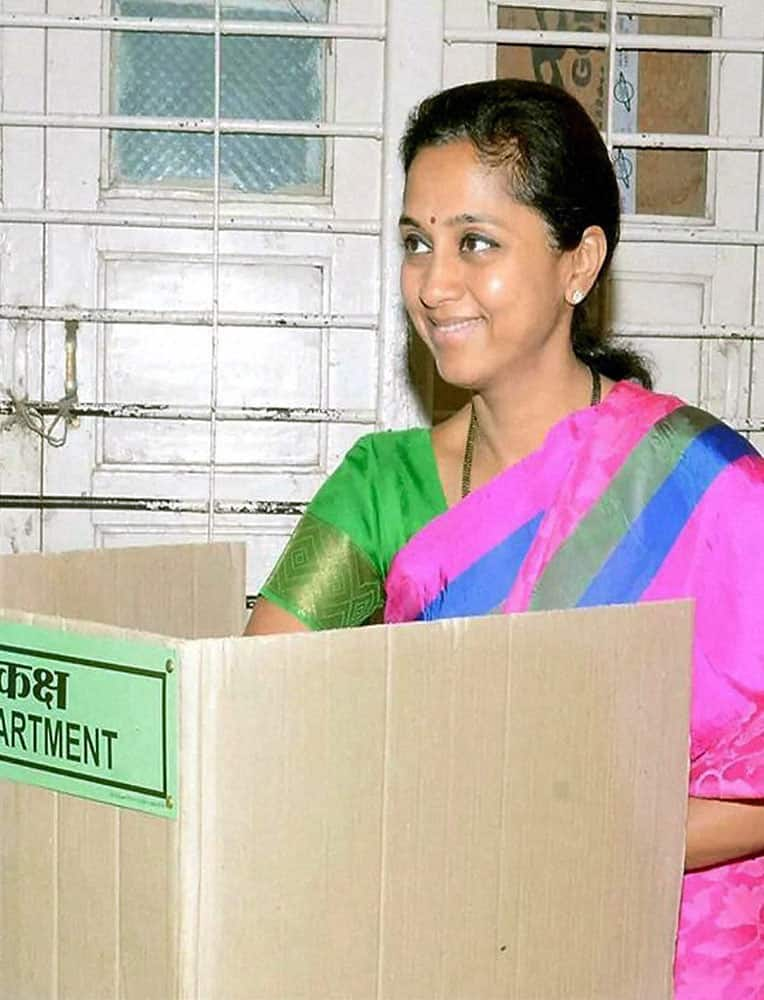 NCP MP Supriya Sule while casting her vote for the Assembly elections at a polling booth at Katewadi in Baramati on Wednesday.