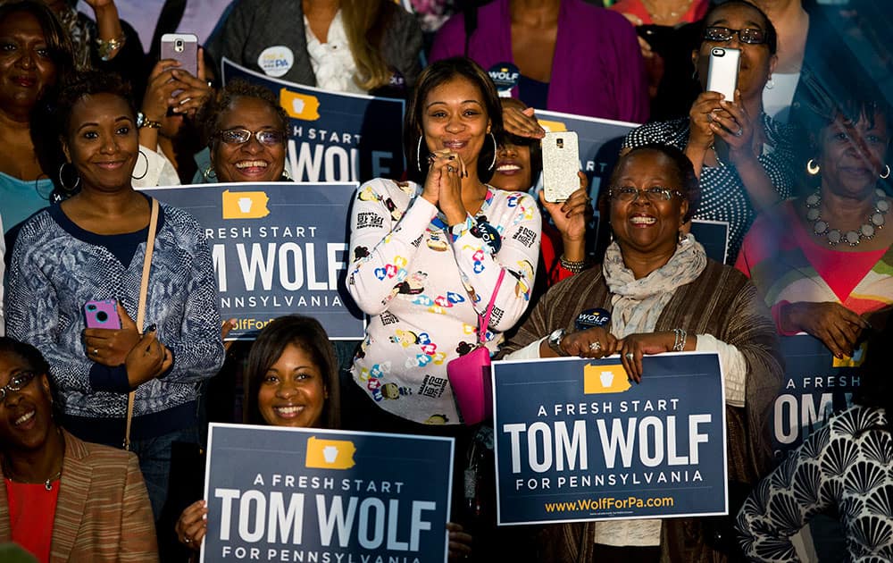 Audence members listen to first lady Michelle Obama campaign for Pennsylvania Democratic gubernatorial candidate Tom Wolf at the Dorothy Emanuel Recreation Center in Philadelphia. 