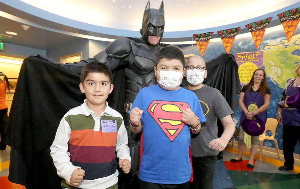 Batman visits and entertains patients for Halloween during a Spirit of Children party at Mattel Children's Hospital UCLA in Los Angeles. 