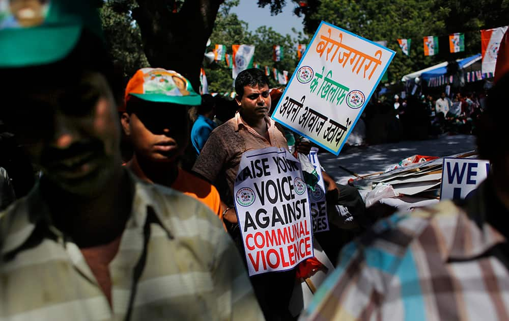 A supporter of All India Trinamool Congress (Youth) participates in an anti-government rally in New Delhi.