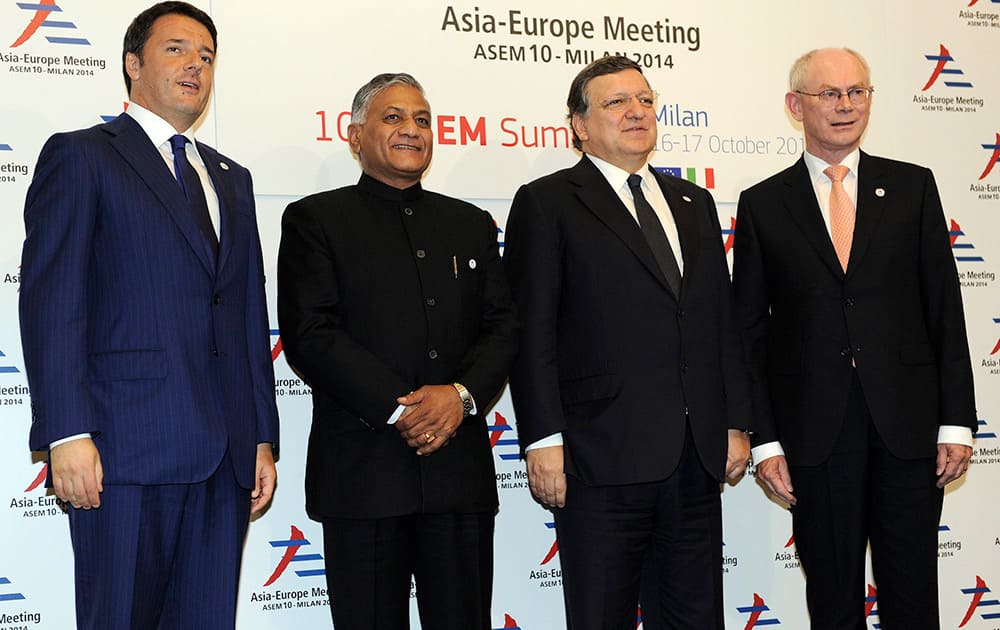 From left, Italian Premier Matteo Renzi, Indian Minister of State for External Affairs Vijay Kumar Singh, EU Commission President Jose Manuel Barroso and EU Council President Herman Van Rompuy pose for photographers at the 10th Asia-Europe Meeting (ASEM) in Milan, Italy.