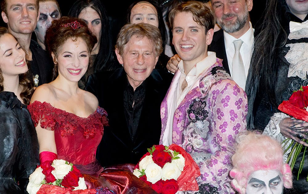 Director Roman Polanski, center, poses with Actress Rafaelle Cohen, playing Sarah, left, and Daniele Carta Mantiglia playing Alfred , right, at the end of the premiere of 'The Fearless Vampire Killers', in Paris.