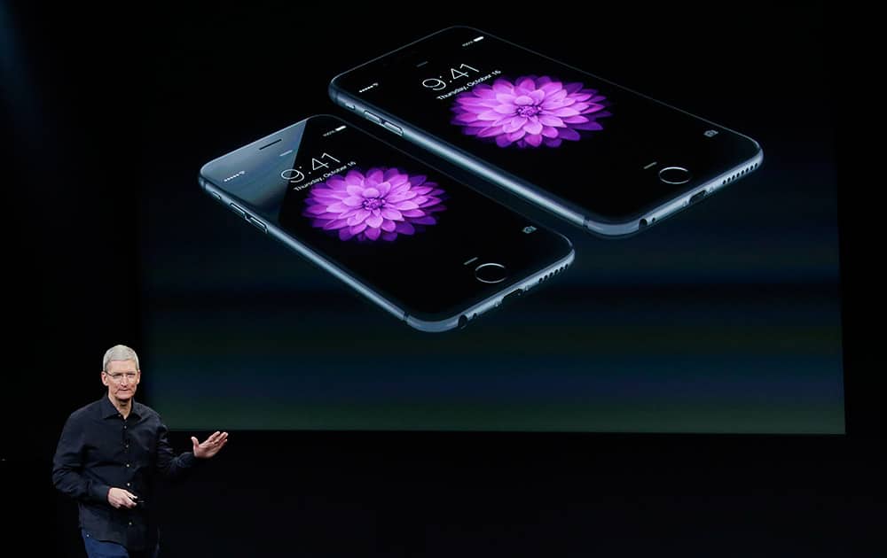 Apple CEO Tim Cook discusses new products during an event at Apple headquarters, in Cupertino, Calif.