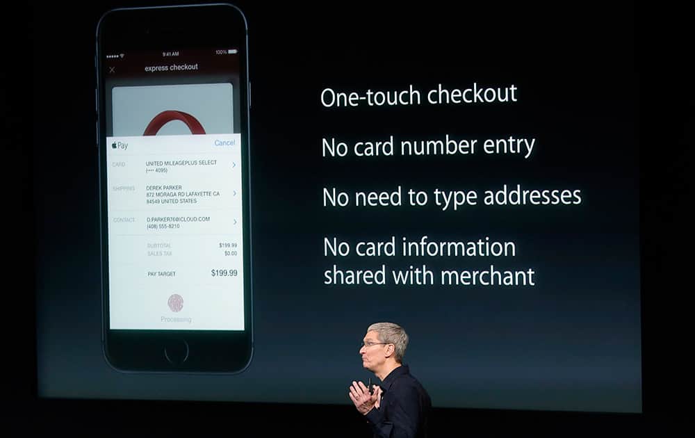 Apple CEO Tim Cook discusses the new Apple Pay product during an event at Apple headquarters, in Cupertino, Calif
