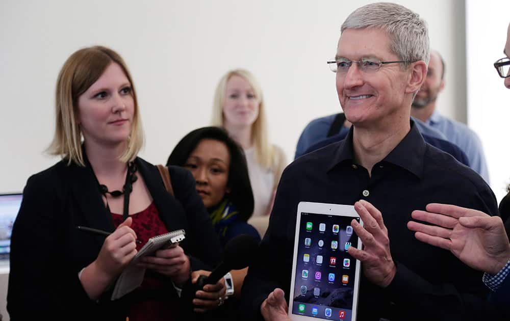 Apple CEO Tim Cook display the new iPad Air 2 at Apple headquarters.