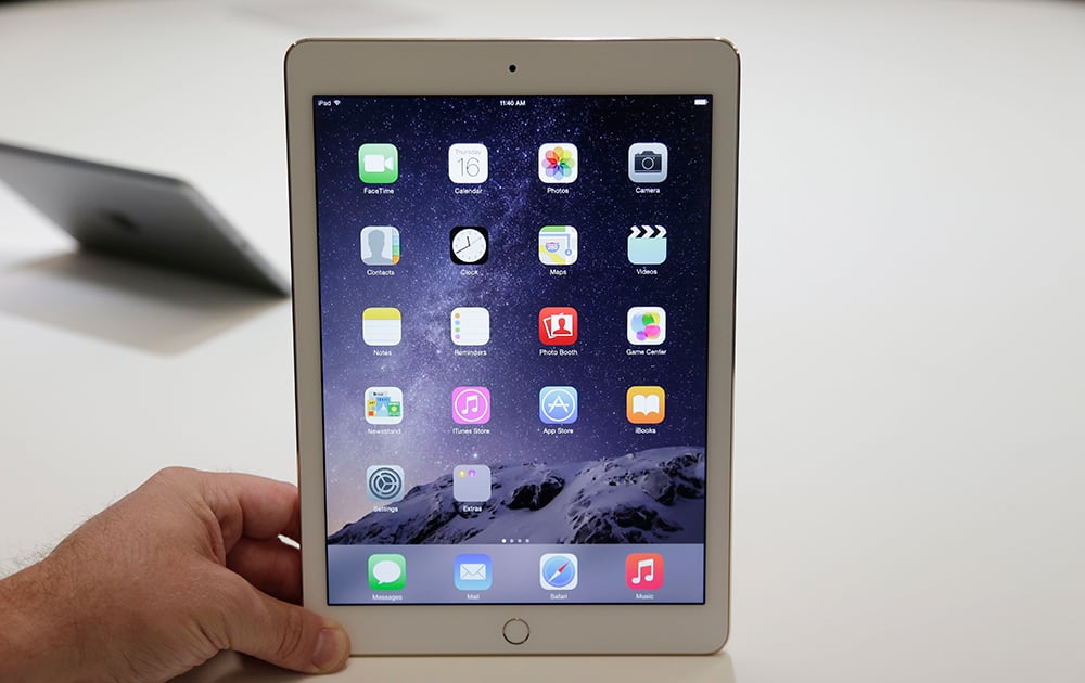 The iPad Air 2 is on display at Apple headquarters, in Cupertino, Calif. Apple unveiled the thinner iPad with a faster processor and a better camera as it tries to drive excitement for tablets amid slowing demand.