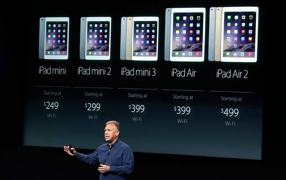 Phil Schiller, Apple's senior vice president of worldwide product marketing, discuss the pricing of the Apple iPad line-up during an event at Apple headquarters, in Cupertino, Calif.