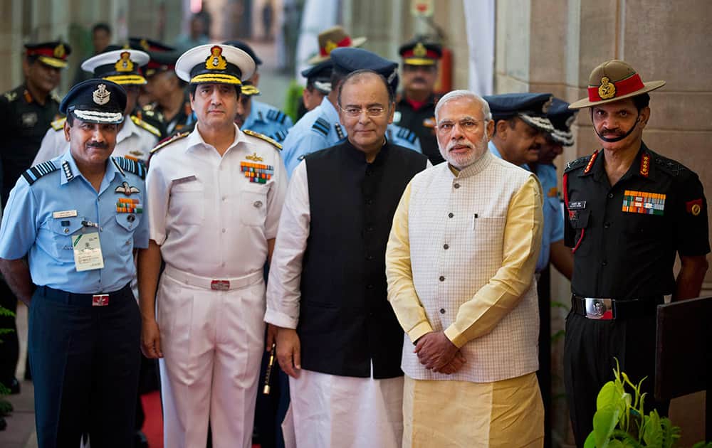 Prime Minister Narendra Modi, poses for a photograph with Indian Air Force chief Arup Raha, navy chief D.K. Joshi, Indian Defense Minister Arun Jaitley and Indian Army chief Dalbir Singh Suhag before attending 'Combined Commanders' conference in New Delhi.