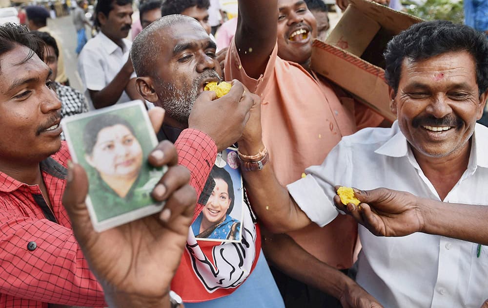 Jayalalithas supporters celebrate after she was granted bail by the Supreme Court, near the Central jail, in Bengaluru.