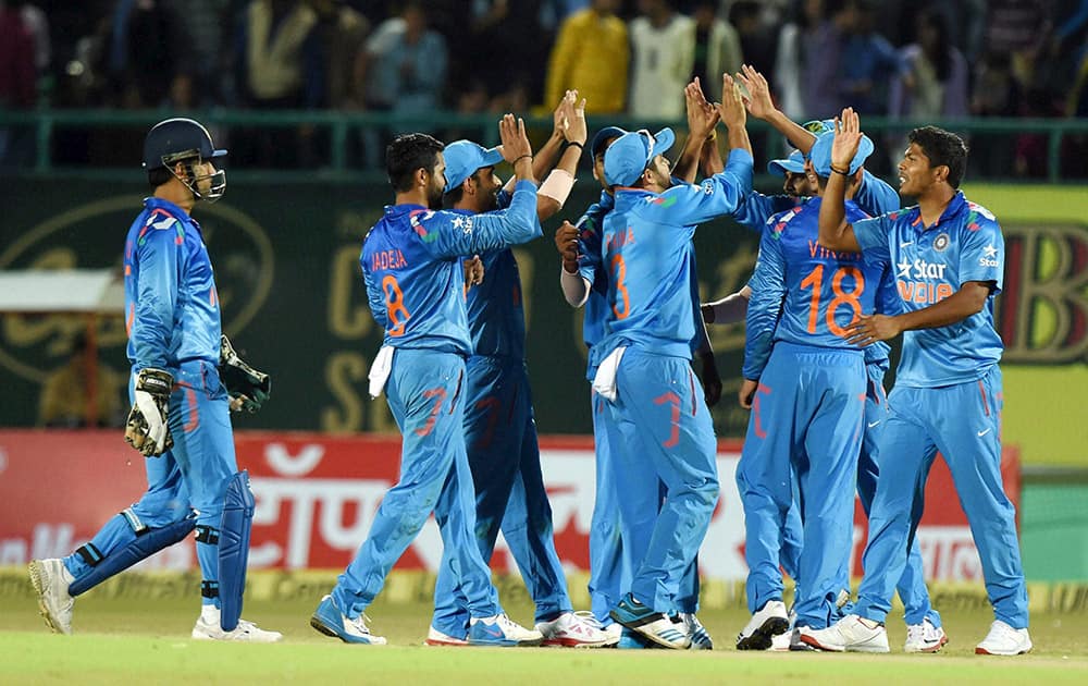 Indian team celebrates the dismissal of Ramdin during the India West Indies ODI being played in Dharamshala