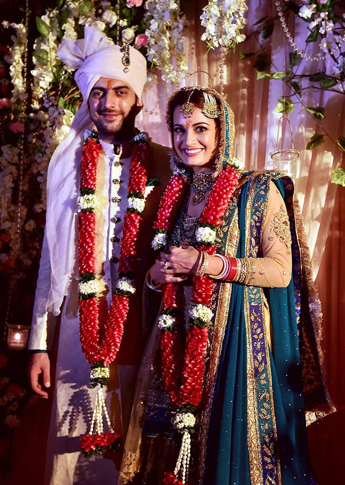 Bollywood actress Dia Mirza poses with her long-time beau Sahil Sangha after she got married with him.