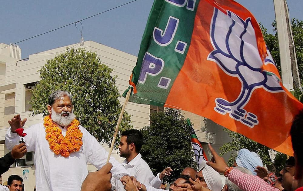 BJP candidate Anil Vij takes out a victory procession after his win in Assembly polls in Ambala.