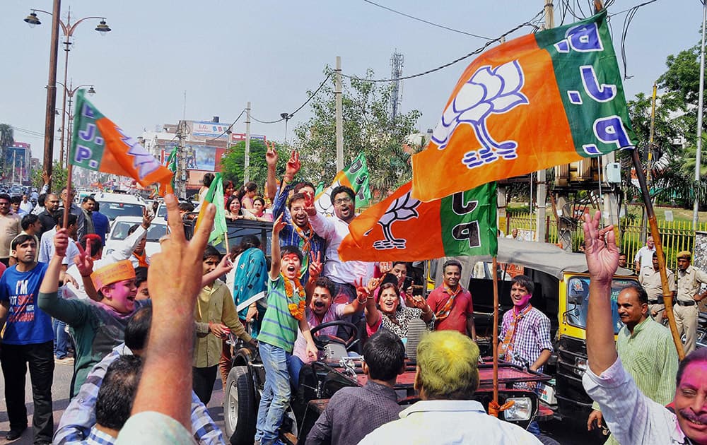 BJP workers celebrating the partys victory in the Assembly polls in Rohtak.