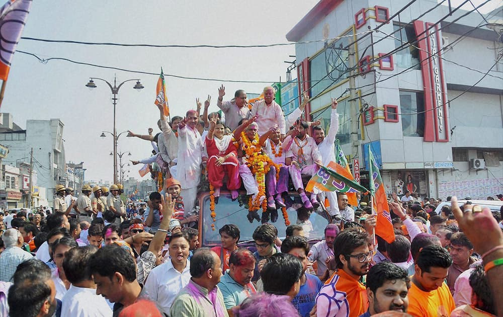 BJP candidate Manish Grover takes out a victory procession after his win in the Assembly polls in Rohtak.