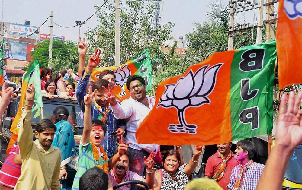 BJP workers celebrating the partys victory in the Assembly polls in Rohtak.