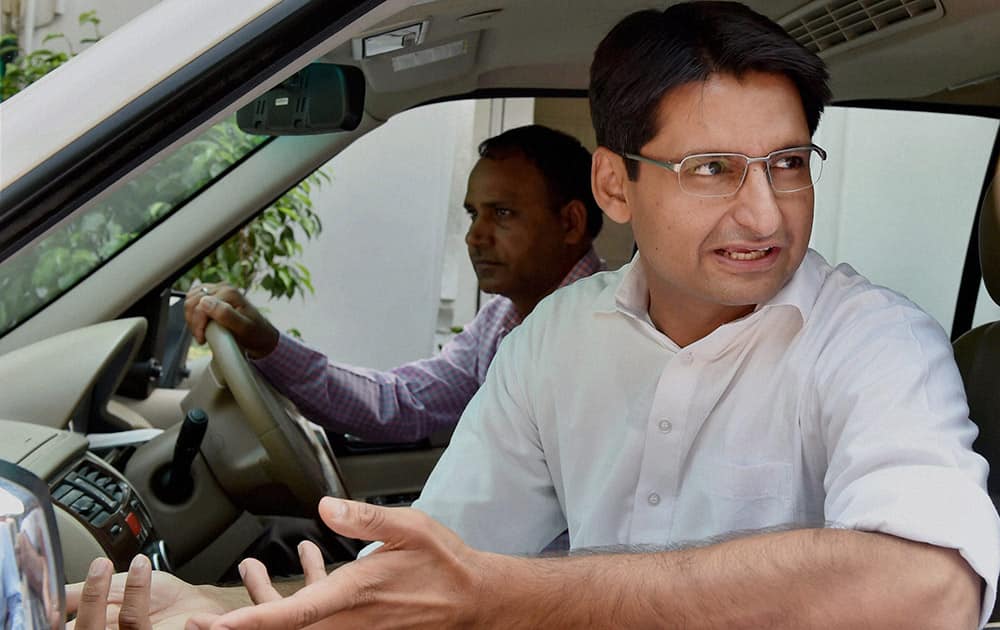 Congress leader Deependra Singh Hooda leaves from his residence in New Delhi.