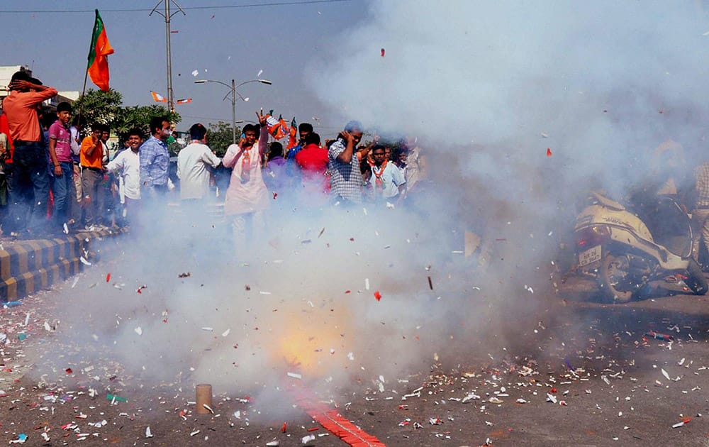 BJP workers celebrating their victory in the Assembly elections in Gurgaon.