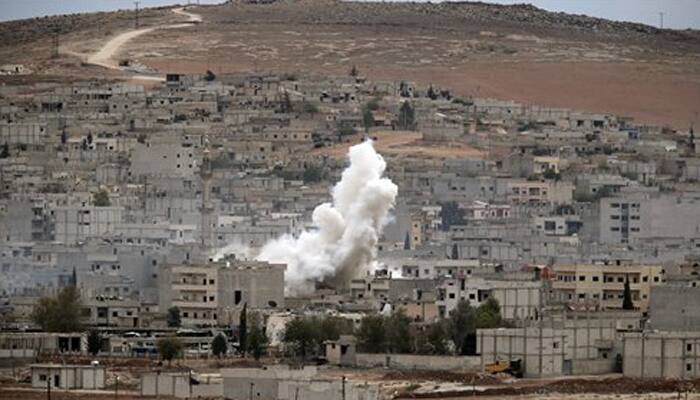 US aids Kurdish fighters with weapons as battle for Kobane continues