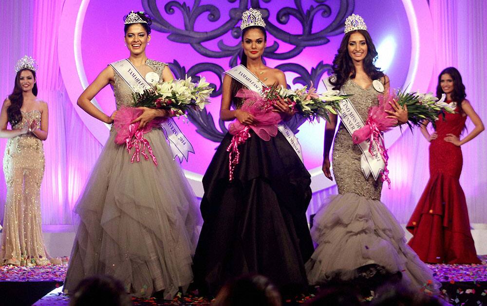 (2nL-2ndR) Asha Bhat, Miss Diva Universe 2014 2nd runner up, Noyonita Lodh, Miss Diva Universe 2014 winner, Alankrita Sahai, Miss Diva Universe 2014 1st runner up pose after being crowned in Mumbai.