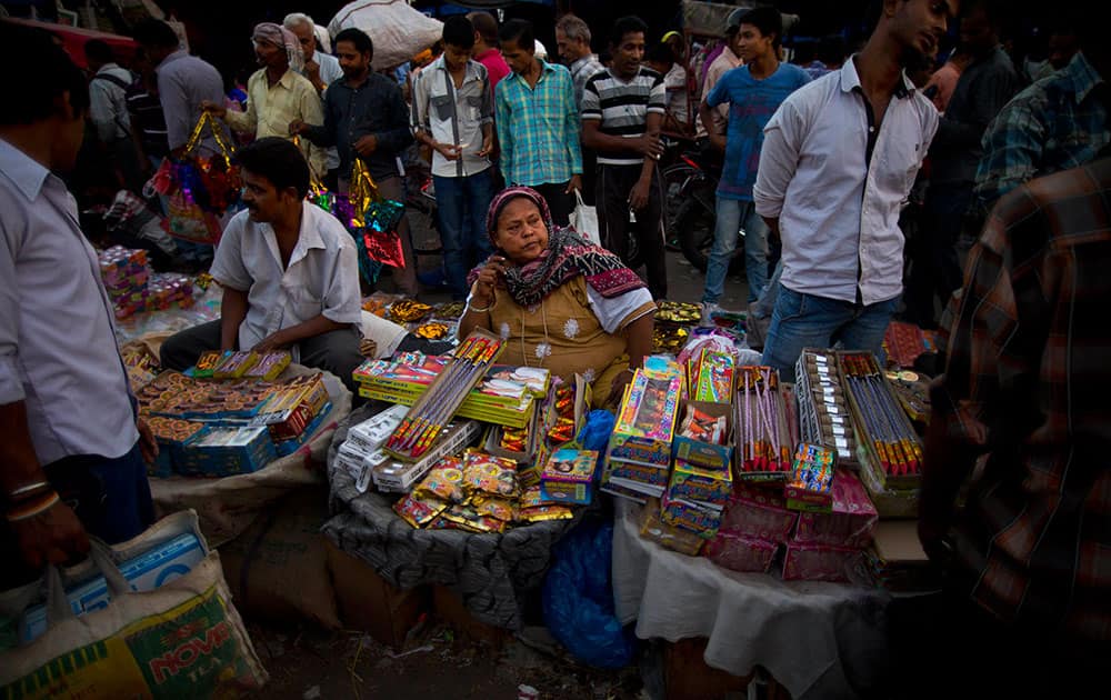 A vendor sells fire crackers ahead of 'Diwali', the Hindu festival of lights, in New Delhi.