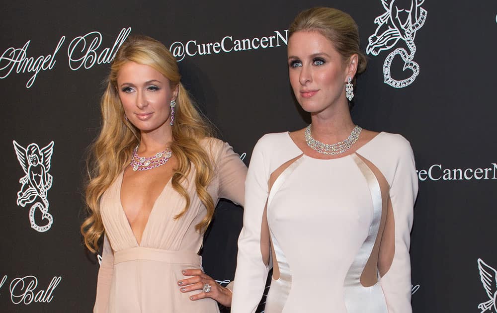 Paris Hilton and Nicky Hilton attend the 2014 Angel Ball, hosted by Gabrielle's Angel Foundation, at Cipriani Wall Street in New York. 