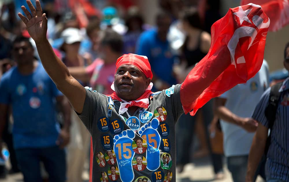 A supporter of Brazil's President and Workers Party candidate Dilma Rousseff, attends a rally for Rousseff's re-election campaign in Rio de Janeiro, Brazil.