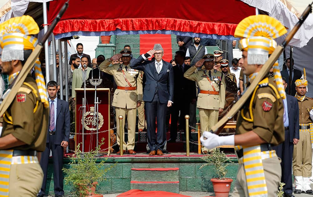 Jammu and Kashmir state Chief Minister Omar Abdullah salutes during a parade to mark Police Commemoration Day, on the outskirts of Srinagar.