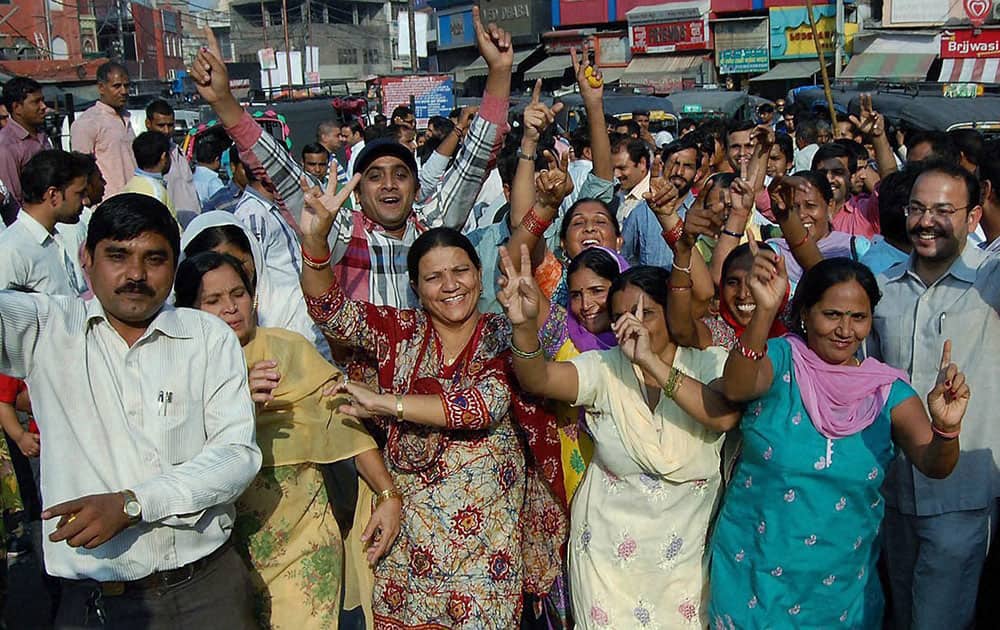 Supporters of Haryana Chief Minister-designate Manohar Lal Khattar celebrates at khattars native village, Banyani of Rohtak district in Haryana.