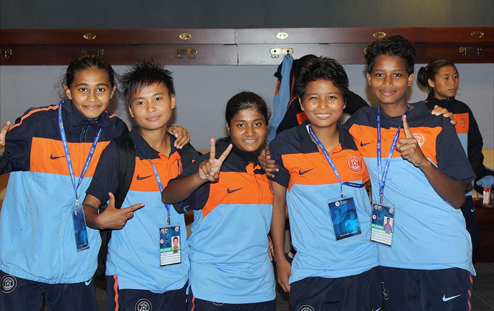 Indian players celebrate in the dressing room after their win against UAE in the AFC U-16 Women’s Championship 2015 qualifiers, in Dhaka.