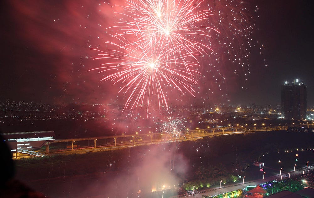 Firecrackers light up the sky as people celebrate Diwali festival in Mumbai.