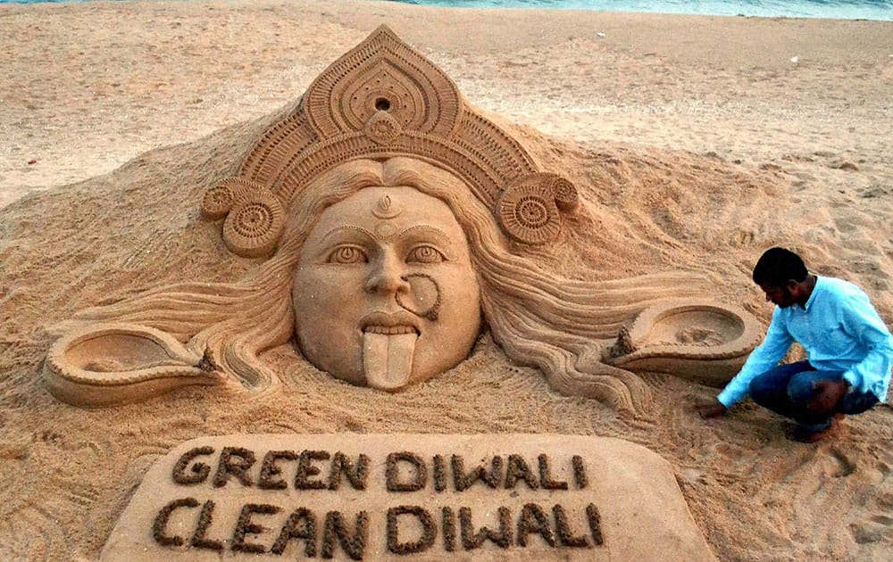 On the eve of Diwali Renowned sand artist Sudarsan Pattnaik created a sand sculpture of goddess Kali with a message Green Diwali Clean Diwali at Puri beach of Odisha.