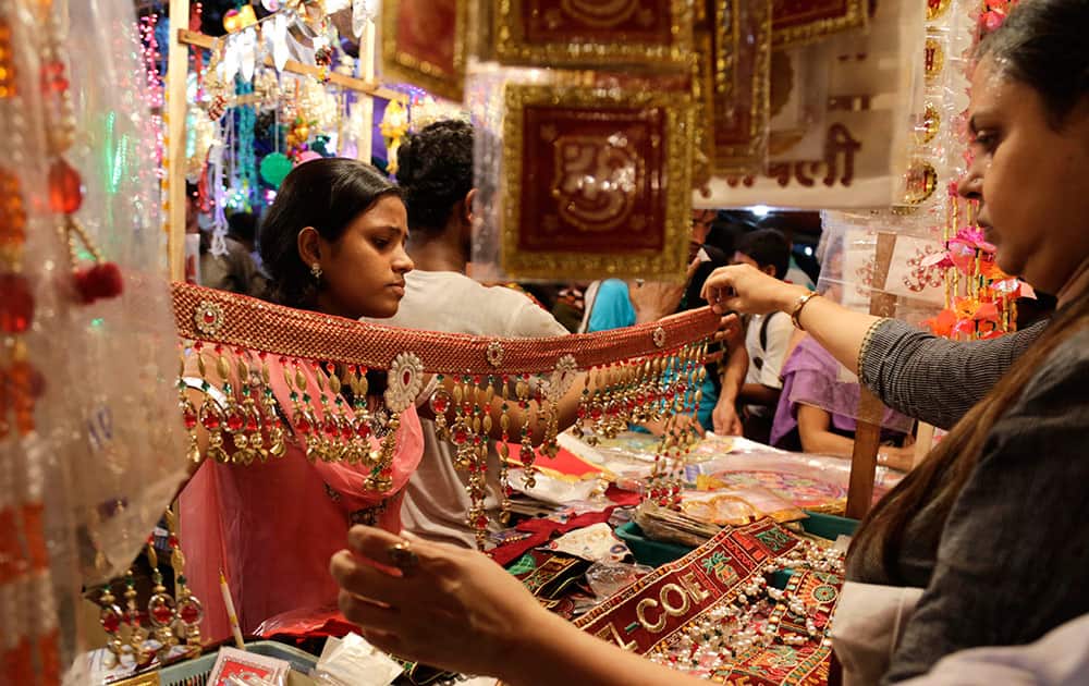 A woman shops for home decoration material ahead of Diwali in Kolkata.