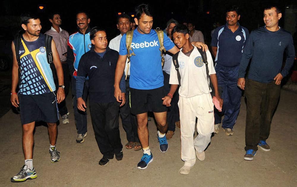 Indian cricket captain MS Dhoni with budding cricketers at JSCA Stadium in Ranchi.