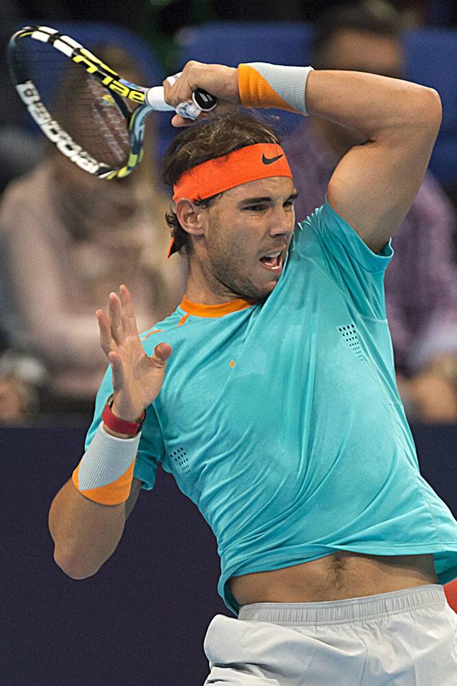 Spains Rafael Nadal returns a ball to Frances Pierre-Hugues Herbert during their round of sixteen match at the Swiss Indoors tennis tournament.