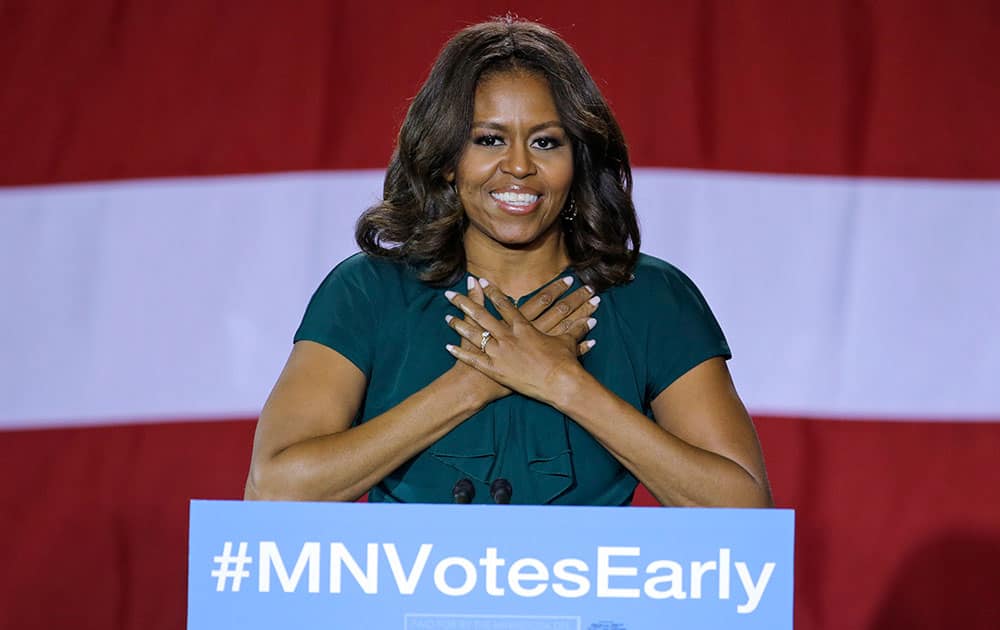 First lady Michelle Obama appears at a get-out-the-vote rally in support for Democratic Sen. Al Franken and Minnesota Democratic Gov. Mark Dayton at Patrick Henry High School in Minneapolis.