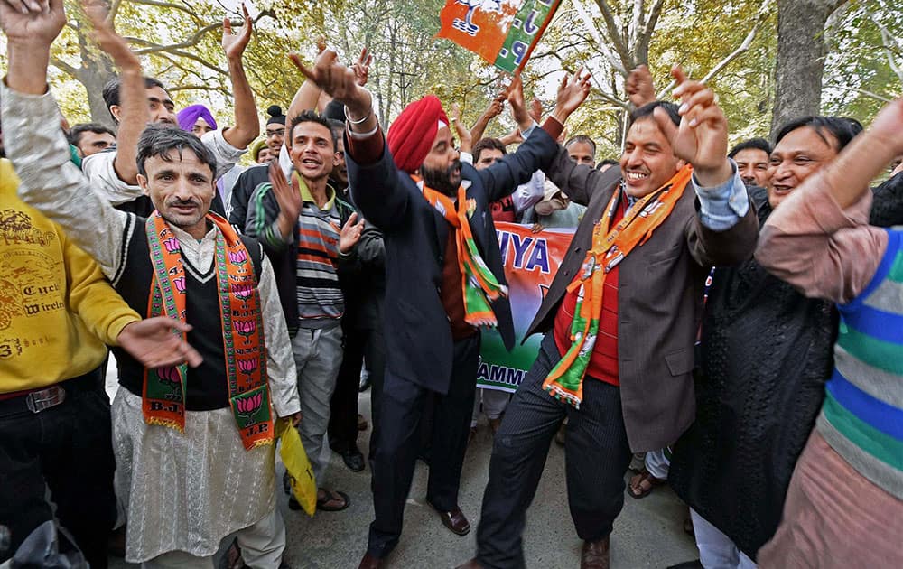Bharatiya Janata Party (BJP) leaders and workers dance and shouts Pro-Modi slogans during a welcome rally ahead of Prime Minister Narendra Modis arrival in Srinagar to celebrate Diwali with the flood victims.