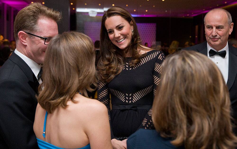 Britain's Kate the Duchess of Cambridge greets supporters as she attends an Autumn gala evening dinner and reception in aid of Action on Addiction at L'Anima Restaurant in London, England.