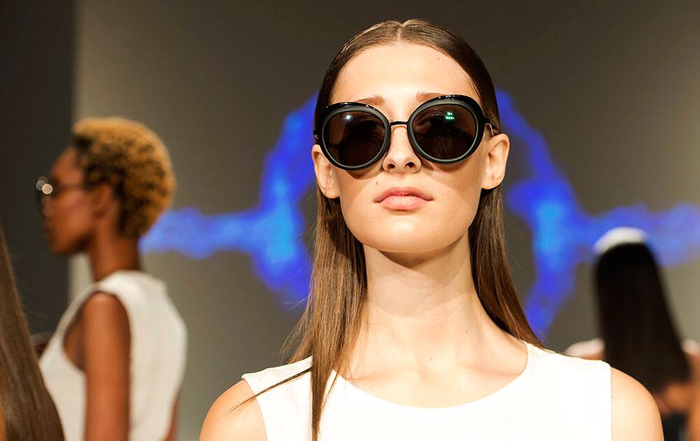 Models pose in the Caitlin Power show, as part of Toronto Fashion Week