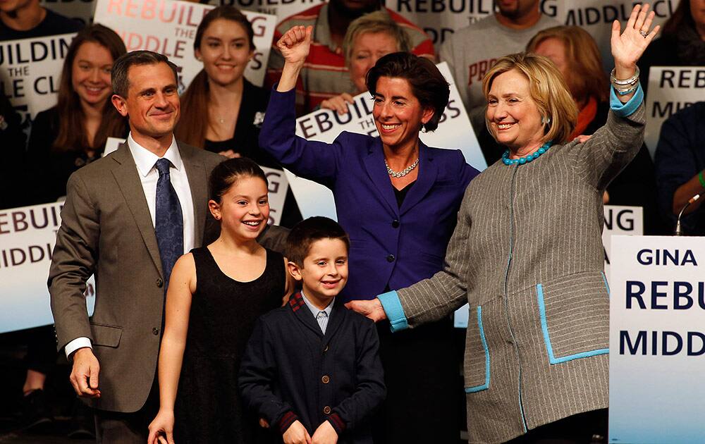 Hillary Rodham Clinton, campaigns for Democratic gubernatorial nominee Gina Raimondo, as Raimondo's husband Andy Moffit and children Ceci and Tommy join her onstage at Rhode Island College in Providence, R.I.