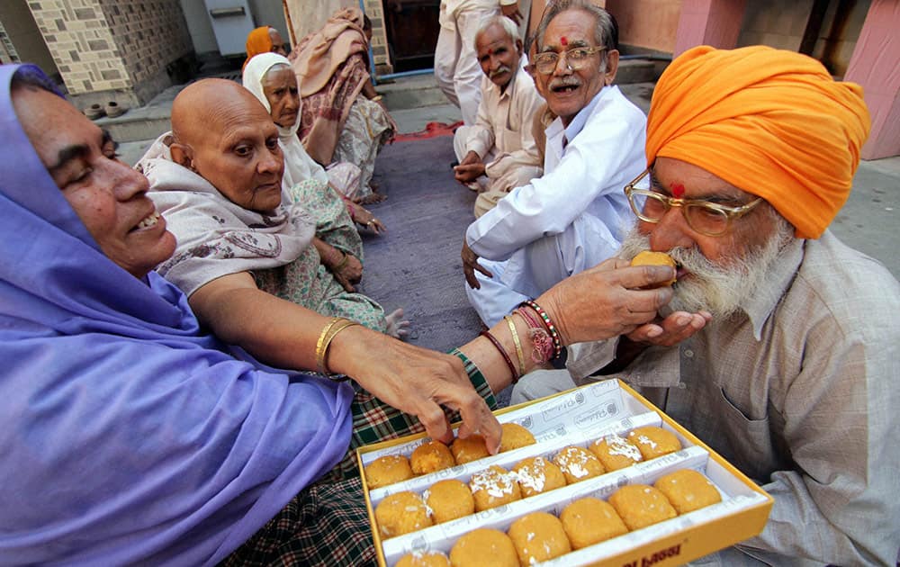 Women of old home celebrate Bhai Dooj festival, in Jammu.