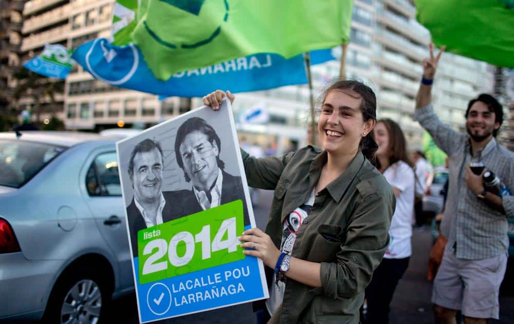 Supporters of presidential candidate Luis Lacalle Pou, from the National Party, campaign one day ahead of elections in Montevideo, Uruguay.
