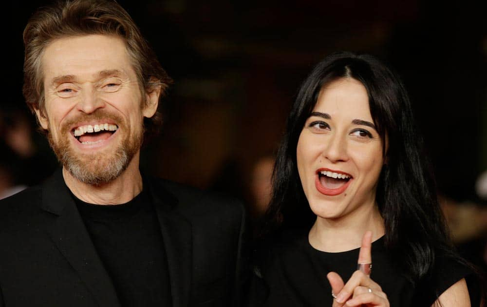 Actor Willem Dafoe pose with his wife Giada Colagrande as they arrive on the red carpet on the occasion of the screening of the movie 'The Most Wanted Man' during the 9th edition of the Rome Film Festival in Rome.