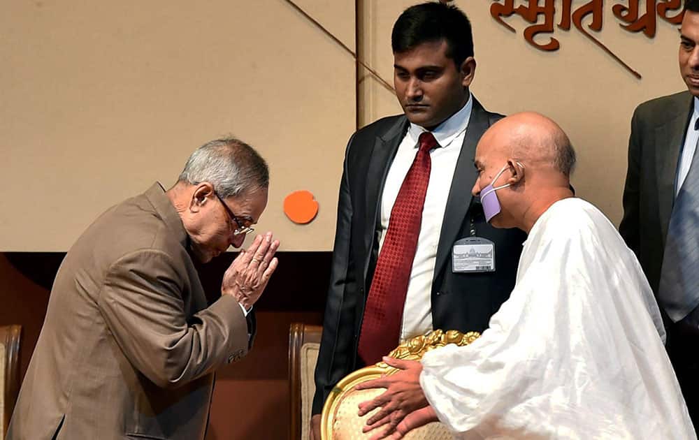  President Pranab Mukherjee exchanges greetings with Acharya Mahashraman during a function to receive first copy of ‘Tulsi Smriti Granth’ at Rashtrapati Bhavan in New Delhi.