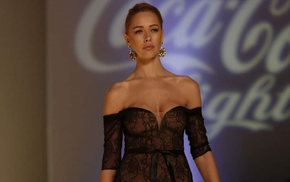 A model presents an outfit by Greek fashion designer Stylianos, during the Athens Exclusive Designers Week.