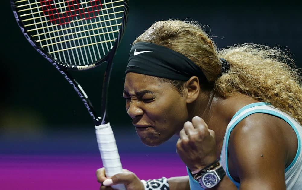  Serena Williams of the U.S. reacts during her singles match against Romania's Simona Halep at the WTA tennis finals in Singapore. 